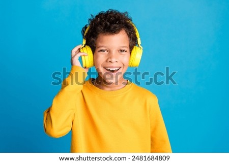 Similar – Image, Stock Photo Smiling ethnic boy with Down syndrome eating fresh apple in kitchen