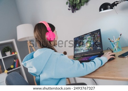 Image, Stock Photo Happy girl playing video games at night