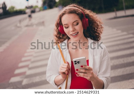 Similar – Image, Stock Photo Adorable girl walking and looking at camera on seaside at sunset