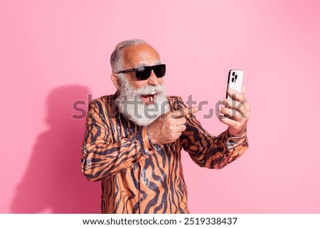 Similar – Image, Stock Photo Smiling eccentric man browsing on smartphone