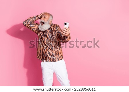 Similar – Image, Stock Photo Smiling eccentric man browsing on smartphone