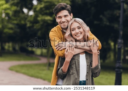 Similar – Image, Stock Photo young attractive couple walking their dogs