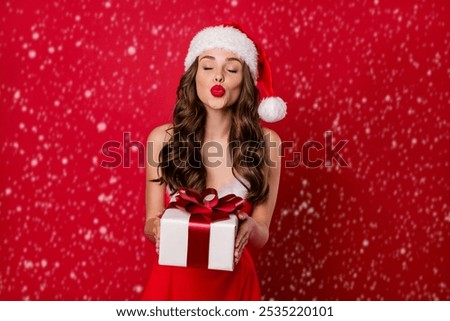 Similar – Image, Stock Photo woman in a Santa hat with lighted sparklers on the background of a New Year or Christmas tree decorated with red ball.