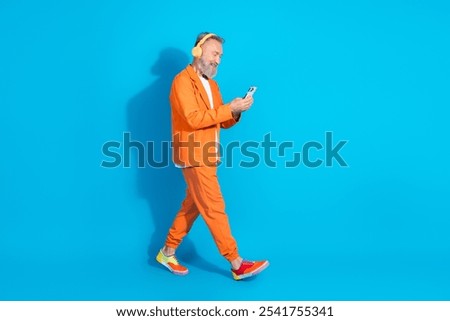 Similar – Image, Stock Photo Smiling eccentric man browsing on smartphone