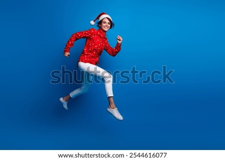 Similar – Image, Stock Photo woman in a Santa hat with lighted sparklers on the background of a New Year or Christmas tree decorated with red ball.