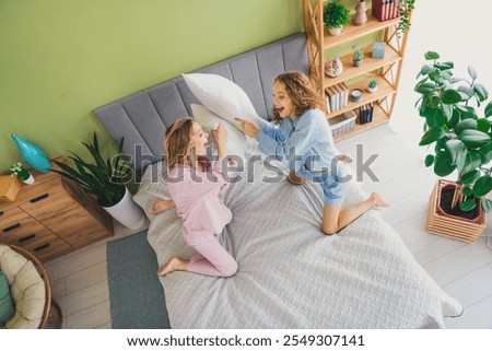 Similar – Image, Stock Photo Pillow fight girl dressed