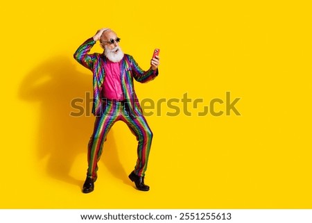 Image, Stock Photo Smiling eccentric man browsing on smartphone