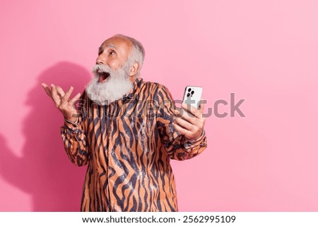 Similar – Image, Stock Photo Smiling eccentric man browsing on smartphone