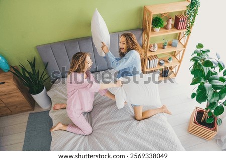 Similar – Image, Stock Photo Pillow fight girl dressed