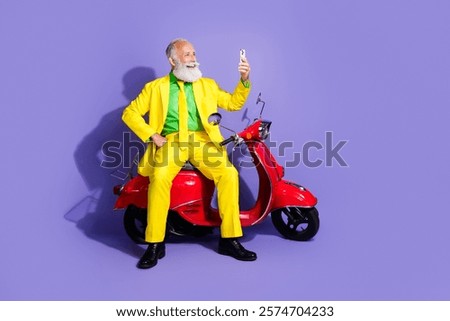 Similar – Image, Stock Photo Smiling eccentric man browsing on smartphone