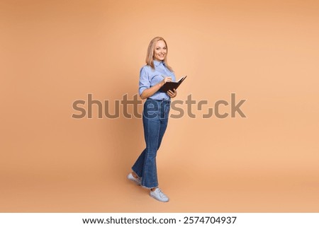 Similar – Image, Stock Photo Blond woman writing on clipboard bending on office desk