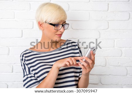 Cute girl looking at phone