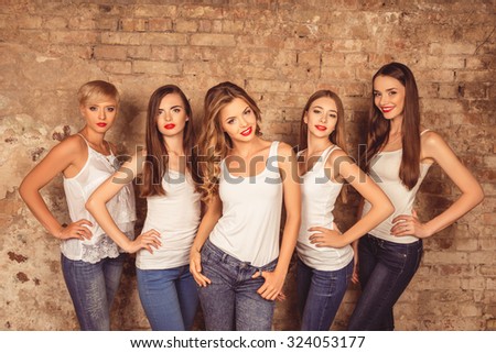 Good-looking young women with red lips wearing dress code