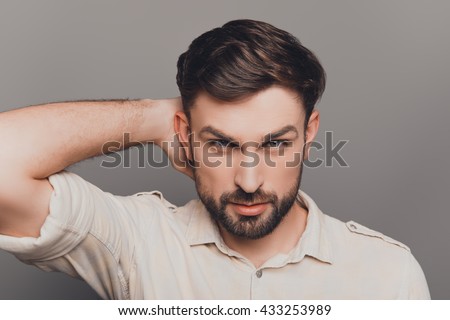 Handsome Serious Young Man Combing His Hair With Fingers Stock Photo ...