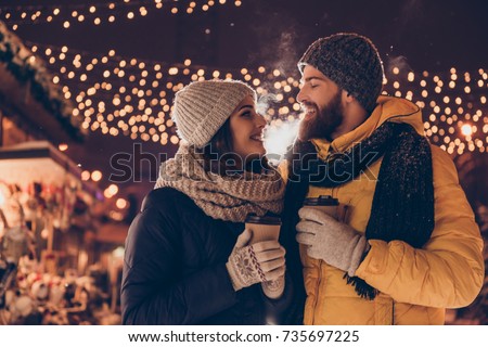 https://image.shutterstock.com/display_pic_with_logo/2797510/735697225/stock-photo-close-up-side-profile-photo-of-beautiful-couple-in-park-x-mas-evening-with-hot-beverages-looking-735697225.jpg