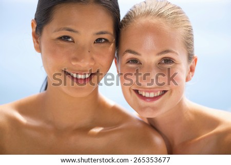 Portrait of two beautiful girls, one asian and one caucasian.