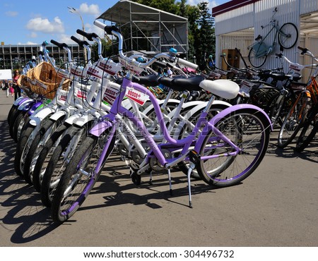 Moscow, Russia - August 6, 2015: Row of bicycles for hire with a sign brand of sportswear \