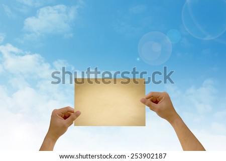 paper in man hand on natural background There is space for you to add your text.