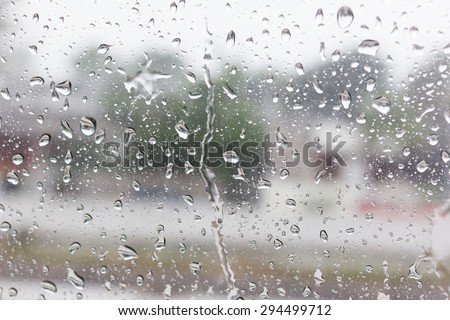 Rain drops on the other side of the glass. With the coming of the rainy season