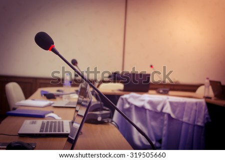 vintage microphone in a meeting room and warm light.