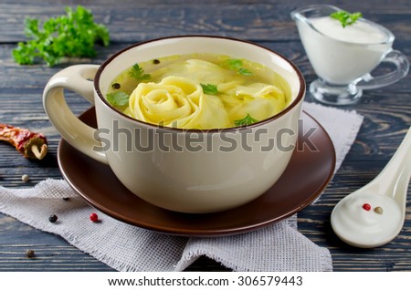 Lazy dumplings in broth - rolls with meat filling