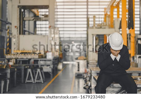 Entrepreneur feel Stressful depressed situation in factory.Unemployed Jobless People Crisis who Recession.Senior worker despair low economic crisis,business failure or government failed manage economy Stock photo © 