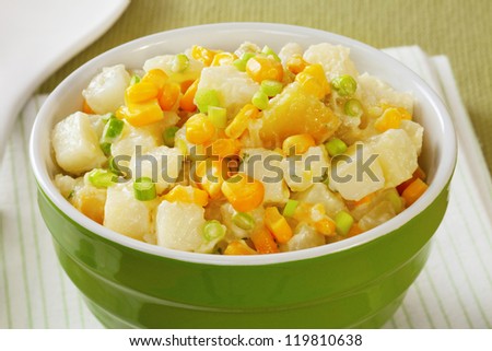 Potato salad, with sweet potato, sweetcorn and garlic shoots in a dill mayonnaise.
