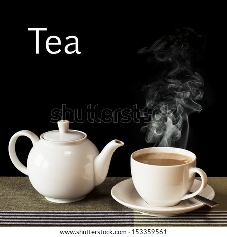 Tea concept - a hot, steaming cup of tea with a teapot, on a black background with the word Tea in white.