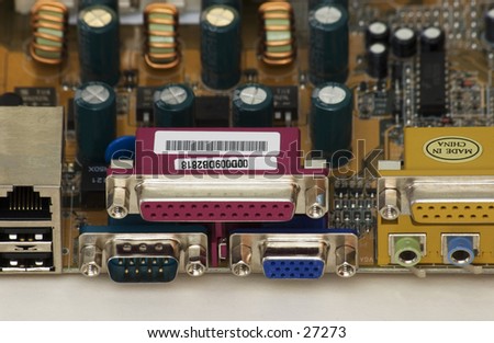 Closup of rear of computer mainboard, showing input & output connectors.
