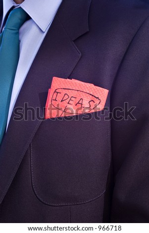 Close up of business man\'s breast pocket, in which he has a napkin or serviette which has been used to note down some ideas during lunch.
