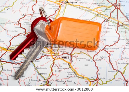 Set of car keys with key ring and tag for writing on, and map of Florence. Place names in Italian.