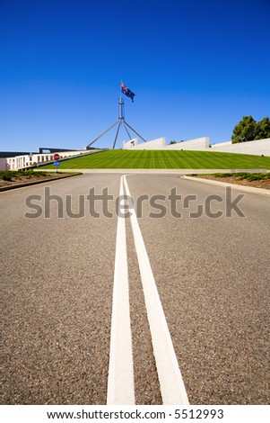 Access road to Parliament House, Canberra, Australia, on a sunny day in January 2006. The Australian flag is flying. The road to power! Copy space.