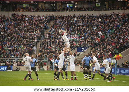 TWICKENHAM LONDON - NOVEMBER 10: Tom Johnson catches the line out ball for England at England vs Fiji, England playing in white Win 54-12 at QBE Rugby Match on November 10, 2012 in Twickenham, England