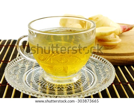 ginger drink and ginger root on wooden table
