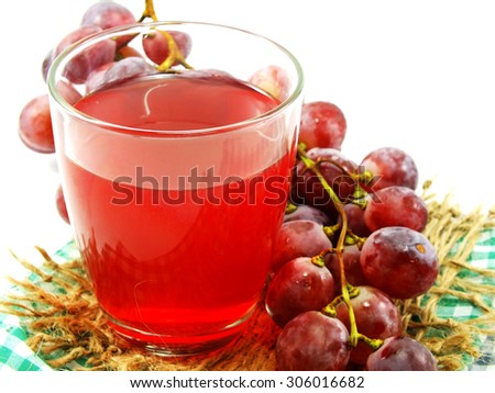 grapes juice and fresh grapes on white background