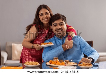 Similar – Image, Stock Photo Sister and brother relaxing at home and using netbook