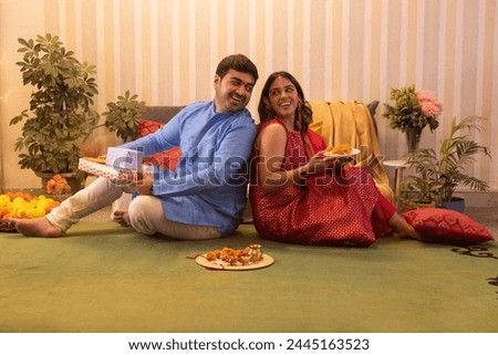 Similar – Image, Stock Photo Sister and brother relaxing at home and using netbook