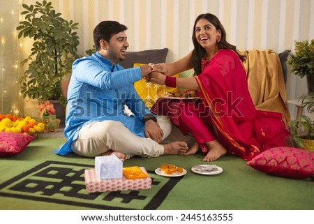 Similar – Image, Stock Photo Sister and brother relaxing at home and using netbook