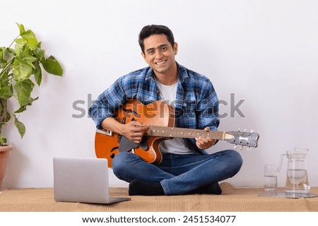 Similar – Image, Stock Photo Musician holding guitar at seaside