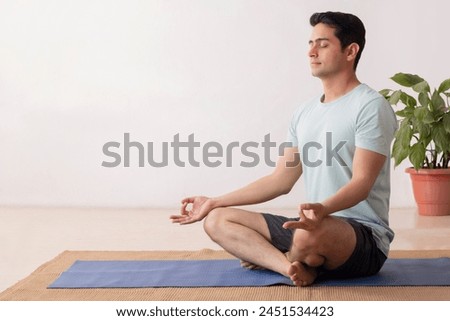 Similar – Image, Stock Photo Man meditating in Lotus pose