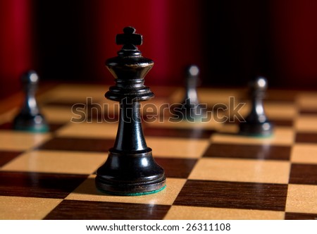 Chess board with king alone as example of game or business concept for power; strategy or success