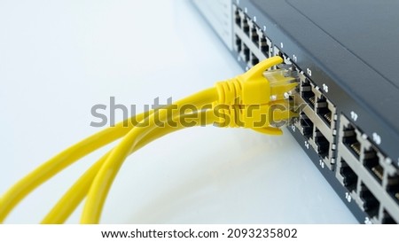 Network cables connected in network switches. Telecommunication ethernet cables connected to internet switch.  Imagine de stoc © 