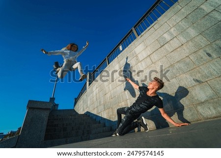 Similar – Image, Stock Photo Woman performing handstand while practicing yoga on street