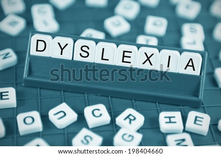 Dyslexia concept with game board and random letters