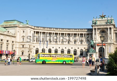 VIENNA, AUSTRIA - JULY 10, 2011: Touristic sightseeing bus in front of the National Library in Vienna, Austria