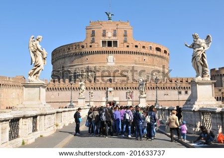 ROME, ITALY - MARCH 28, 2011: Group of tourists visiting Sant Angelo castle, major touristc attraction in Rome