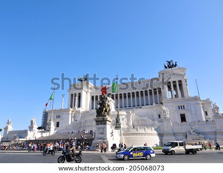 ROME, ITALY - MARCH 30, 2012:  Tourists visit Piazza Venezia, major square and touristic attraction in central Rome