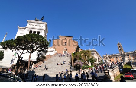 ROME, ITALY - MARCH 30, 2012: Tourists visit Vittorio Emanuele II monument in Piazza Venezia, Rome