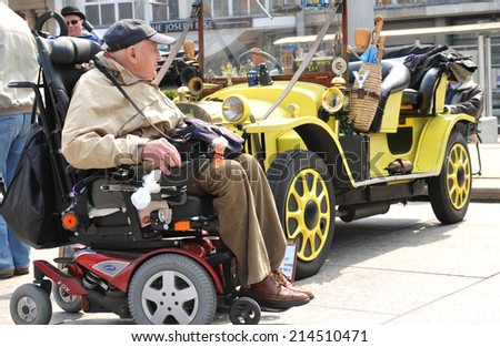 NOTTINGHAM, UK - APRIL 29, 2011: People admire Doctor Who\'s famous car during the vintage cars show in Nottingham