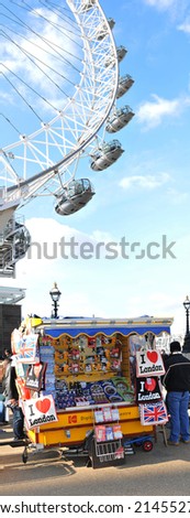 LONDON, UK - MARCH 8, 2011: Central London scene with London\'s Eye and souvenirs shop
